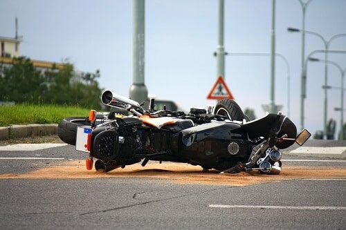 motorcycle that was involved in an accident lying in the road