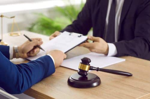 A New York contractor discusses their legal rights with a real estate lawyer.